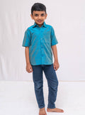 Teal Blue Plain Raw silk half sleeved shirt for Boys.This Teal Blue Plain Raw silk half sleeved shirt is designed for boys, providing both comfort and style.