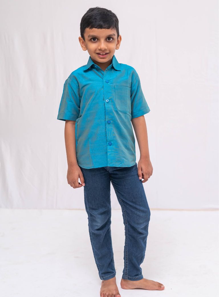 Teal Blue Plain Raw silk half sleeved shirt for Boys.This Teal Blue Plain Raw silk half sleeved shirt is designed for boys, providing both comfort and style.