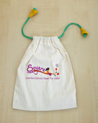 White drawstring bag also known as batwa with 'Soyara' logo ,perfect sustainable gift wrapping for accessories .