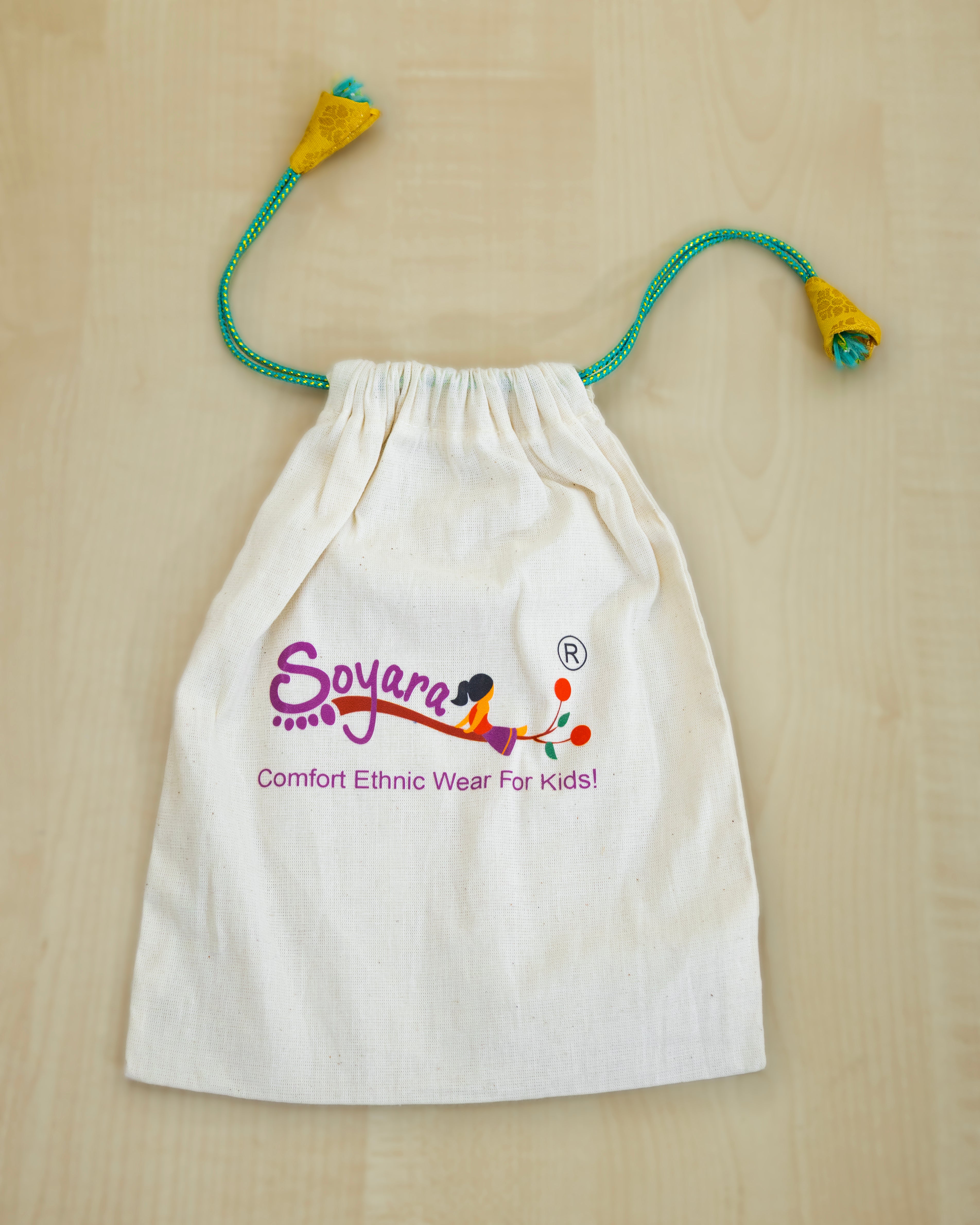 White drawstring bag also known as batwa with 'Soyara' logo ,perfect sustainable gift wrapping for accessories .