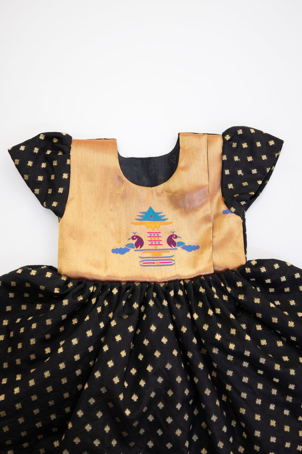 Brocade bodice with plain black pooja silk bottom highlighted with golden border for girls (Copy)