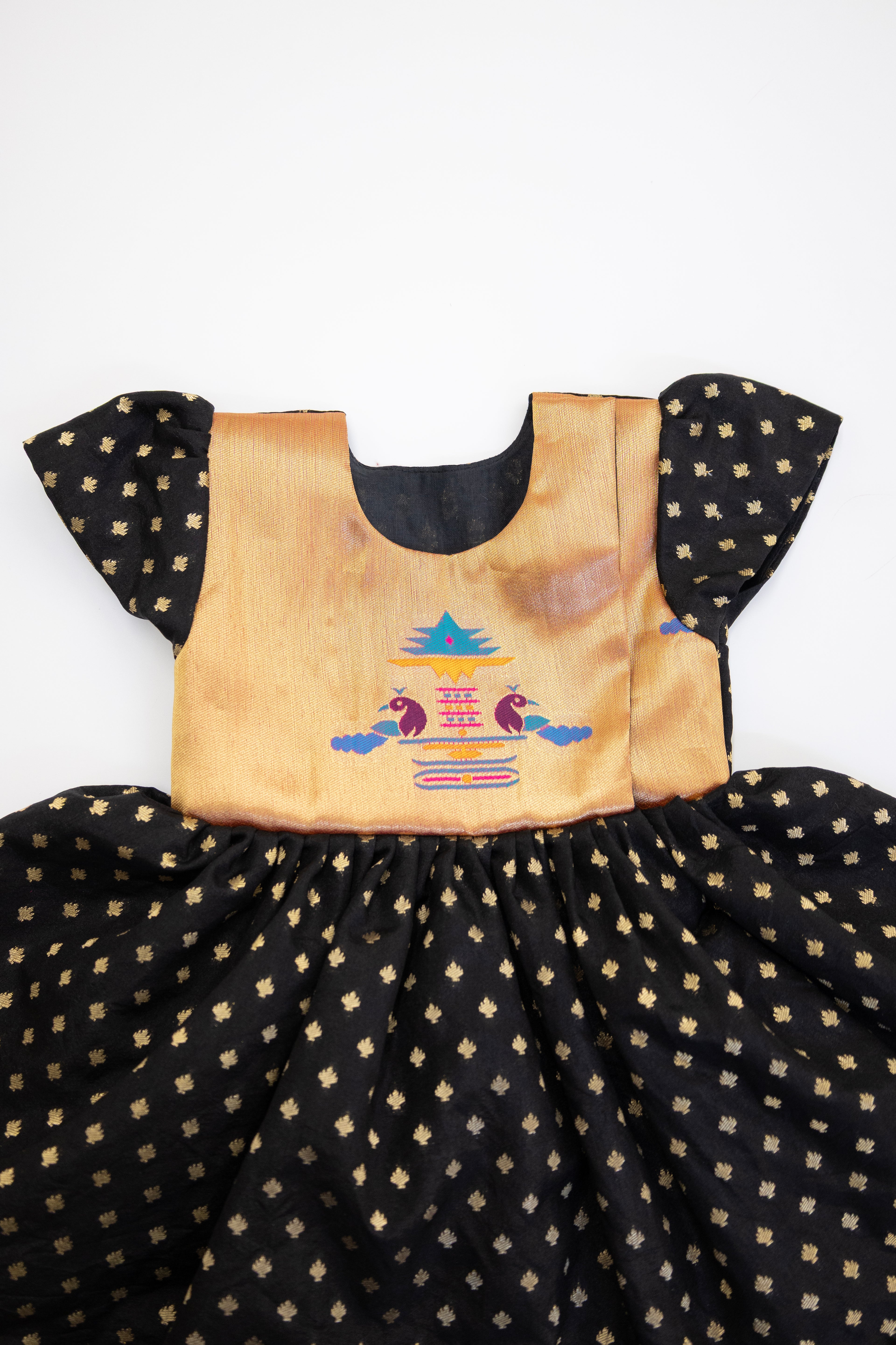 Brocade bodice with plain black pooja silk bottom highlighted with golden border for girls (Copy)