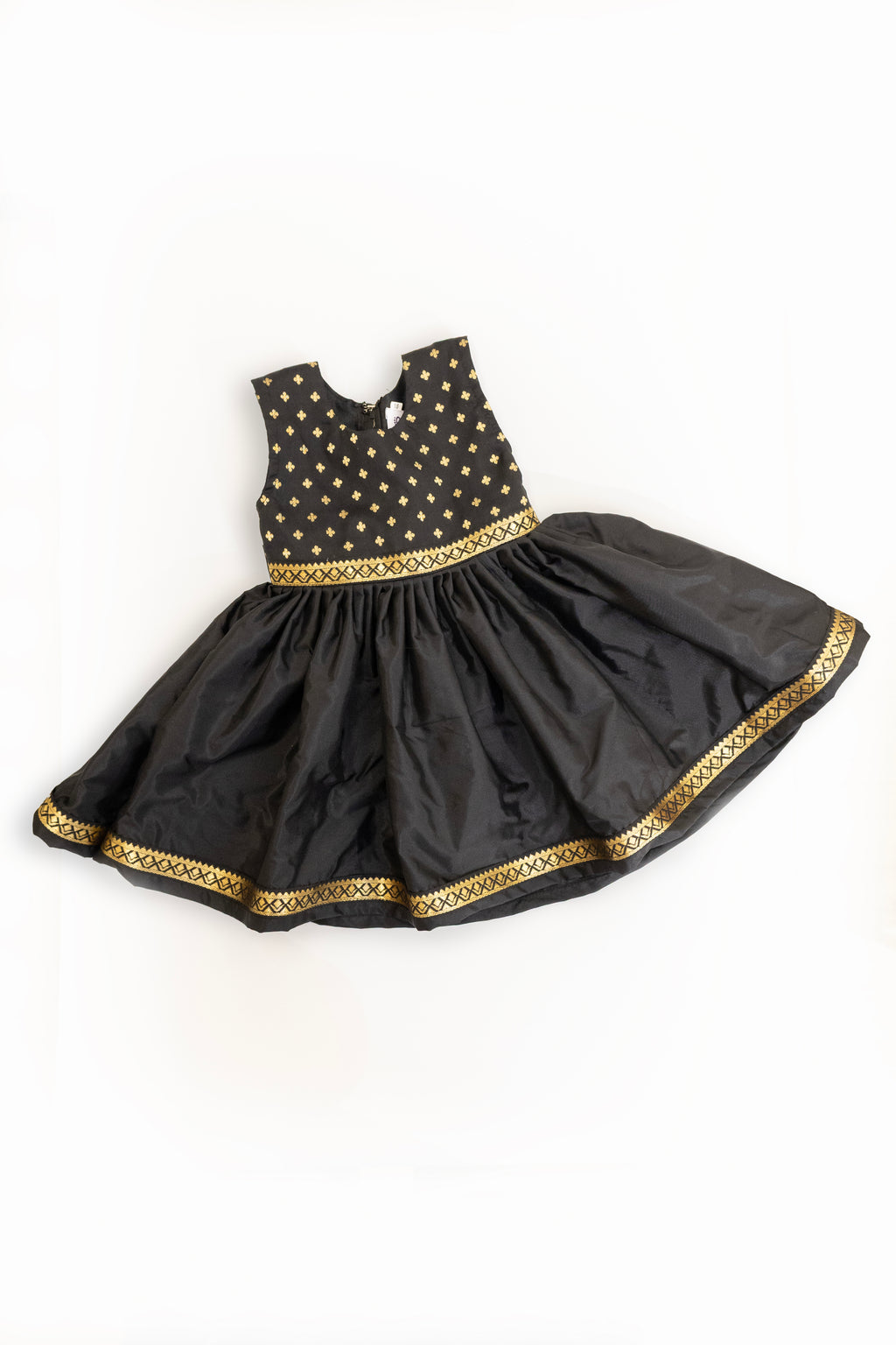 Brocade bodice with plain black pooja silk bottom highlighted with golden border for girls