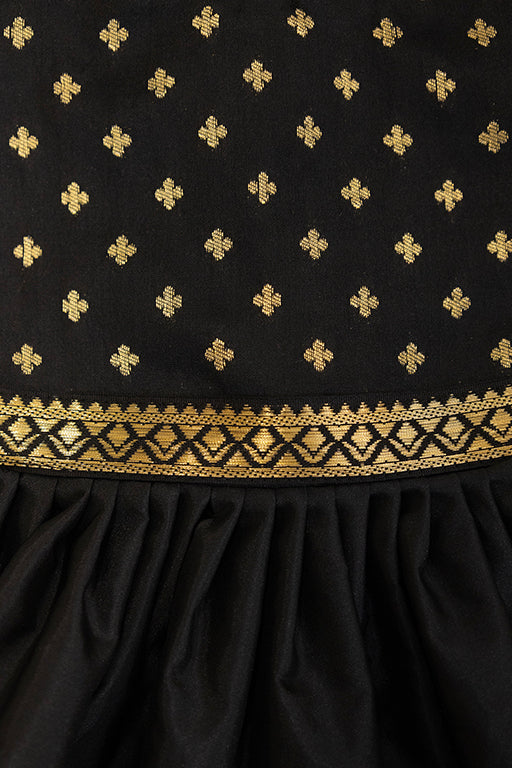 Brocade bodice with plain black pooja silk bottom highlighted with golden border for girls