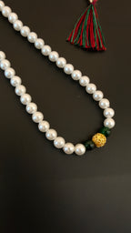 Pearls mala with a golden filigree pendant with green glass beads for a baby boy