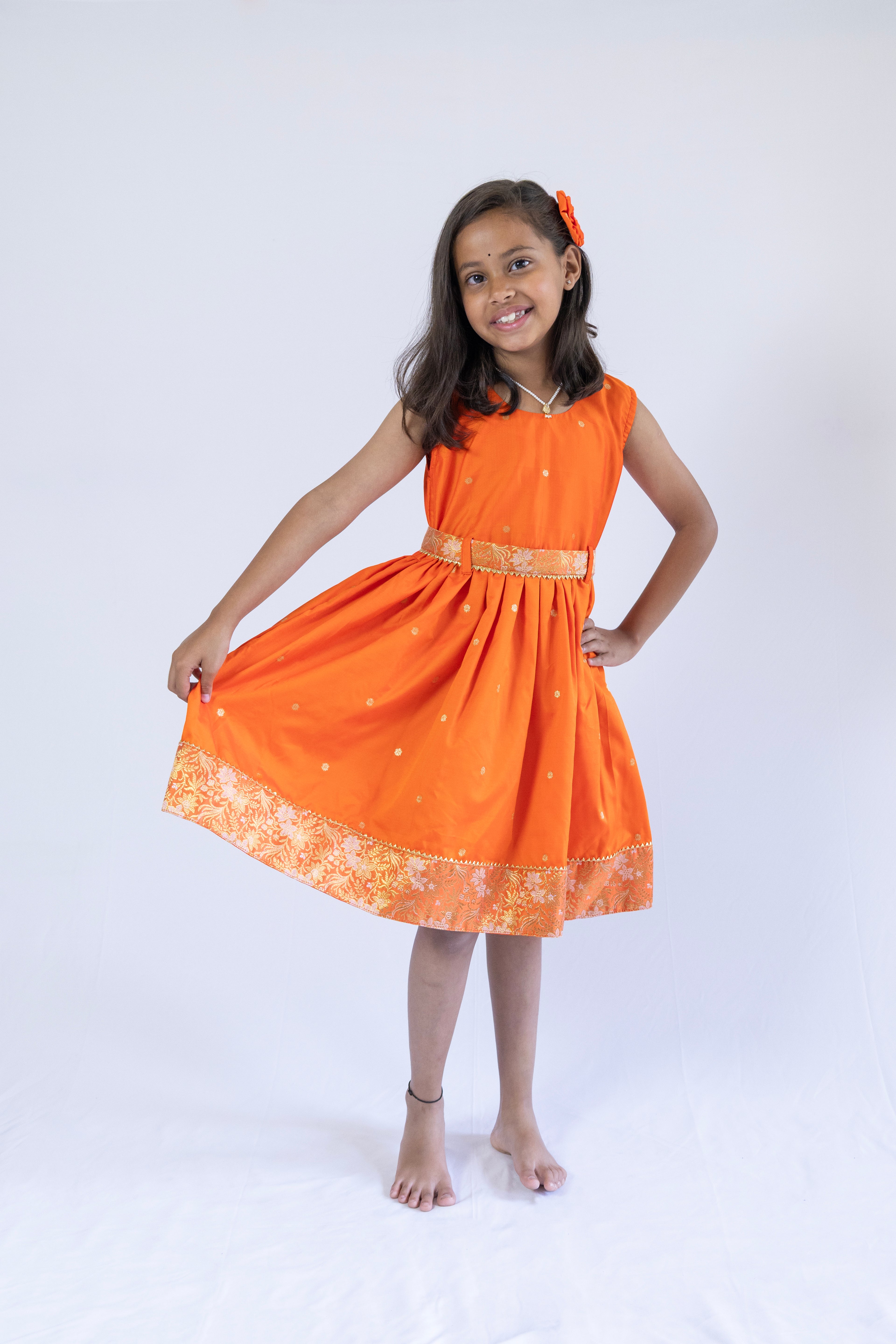 Orange soft banaras brocade silk frock / dress with light orange premium banaras brocade border and a removable jacket for girls