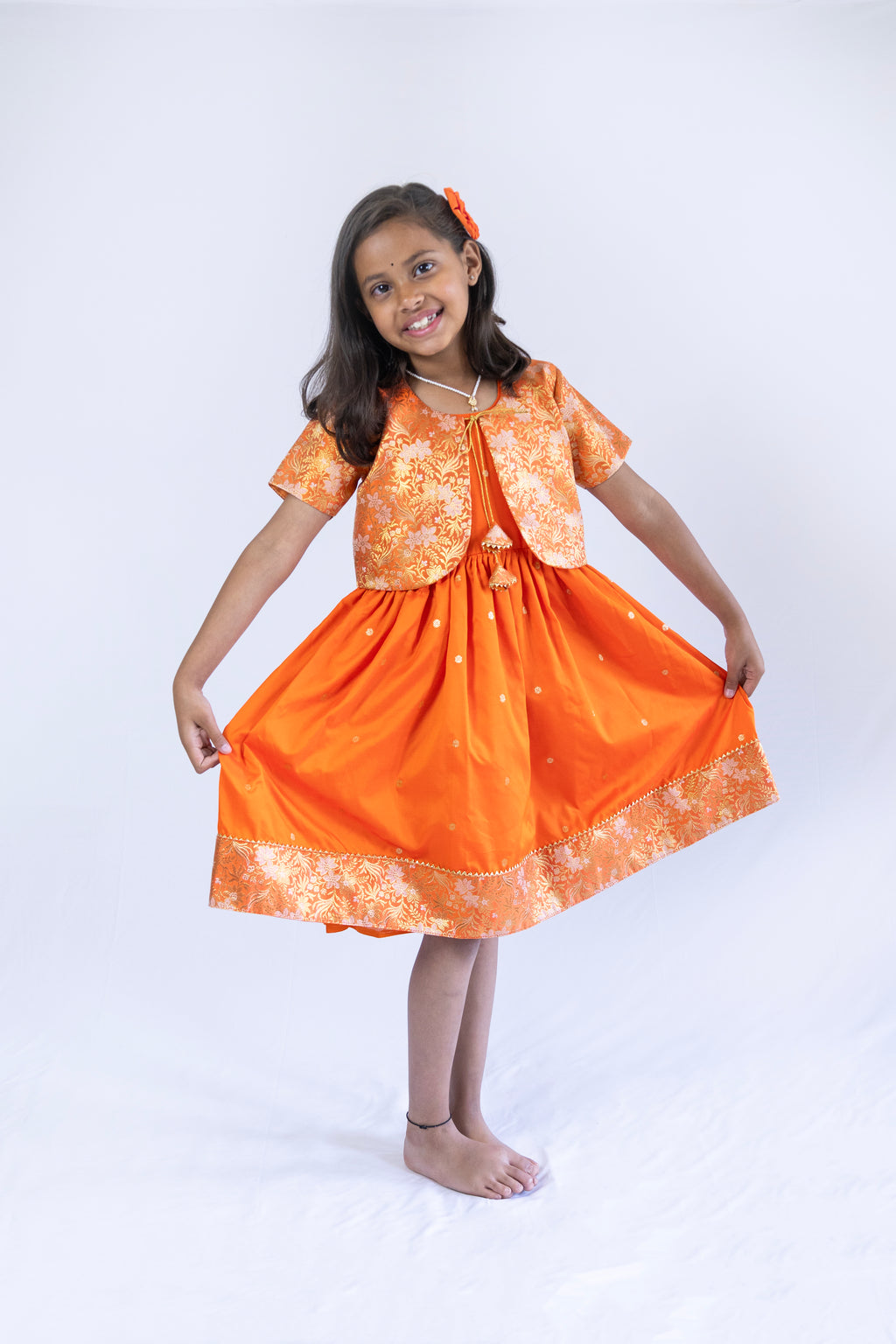 Orange soft banaras brocade silk frock / dress with light orange premium banaras brocade border and a removable jacket for girls
