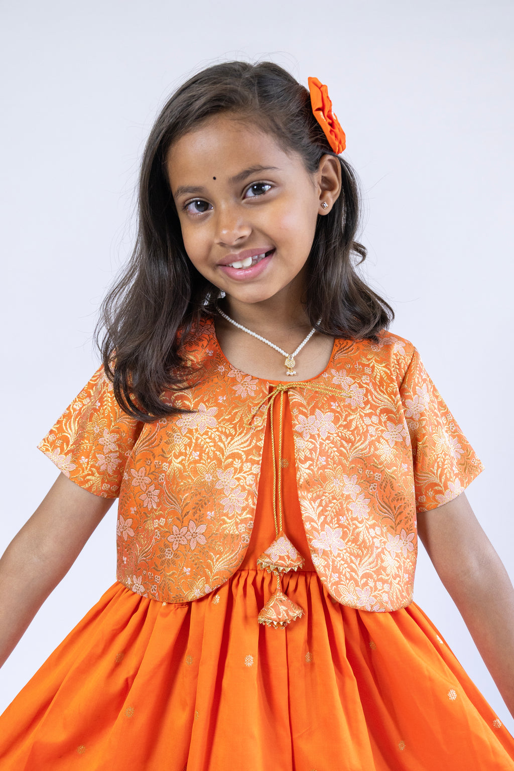 Orange soft banaras brocade silk frock / dress with light orange premium banaras brocade border and a removable jacket for girls