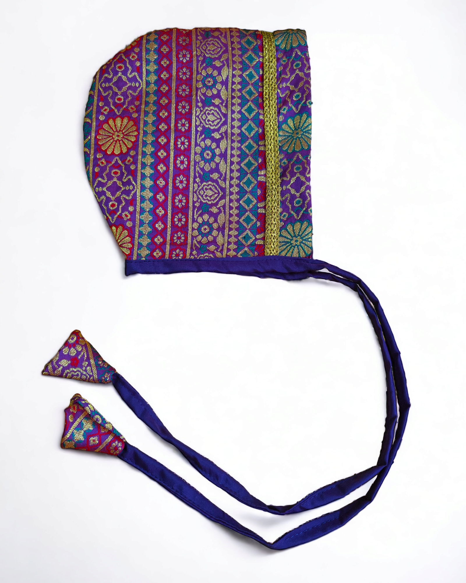 Multi Colored-Purple Banarasi Brocade Silk Baby Bonnet.Golden brocade bonnet,paithani booties,fabric headbands all these Handcrafted accessories for Newborn are perfect add ons to any traditional attire of the baby.Designer baby mats,set of generic bloomers are other naming ceremony essentials.