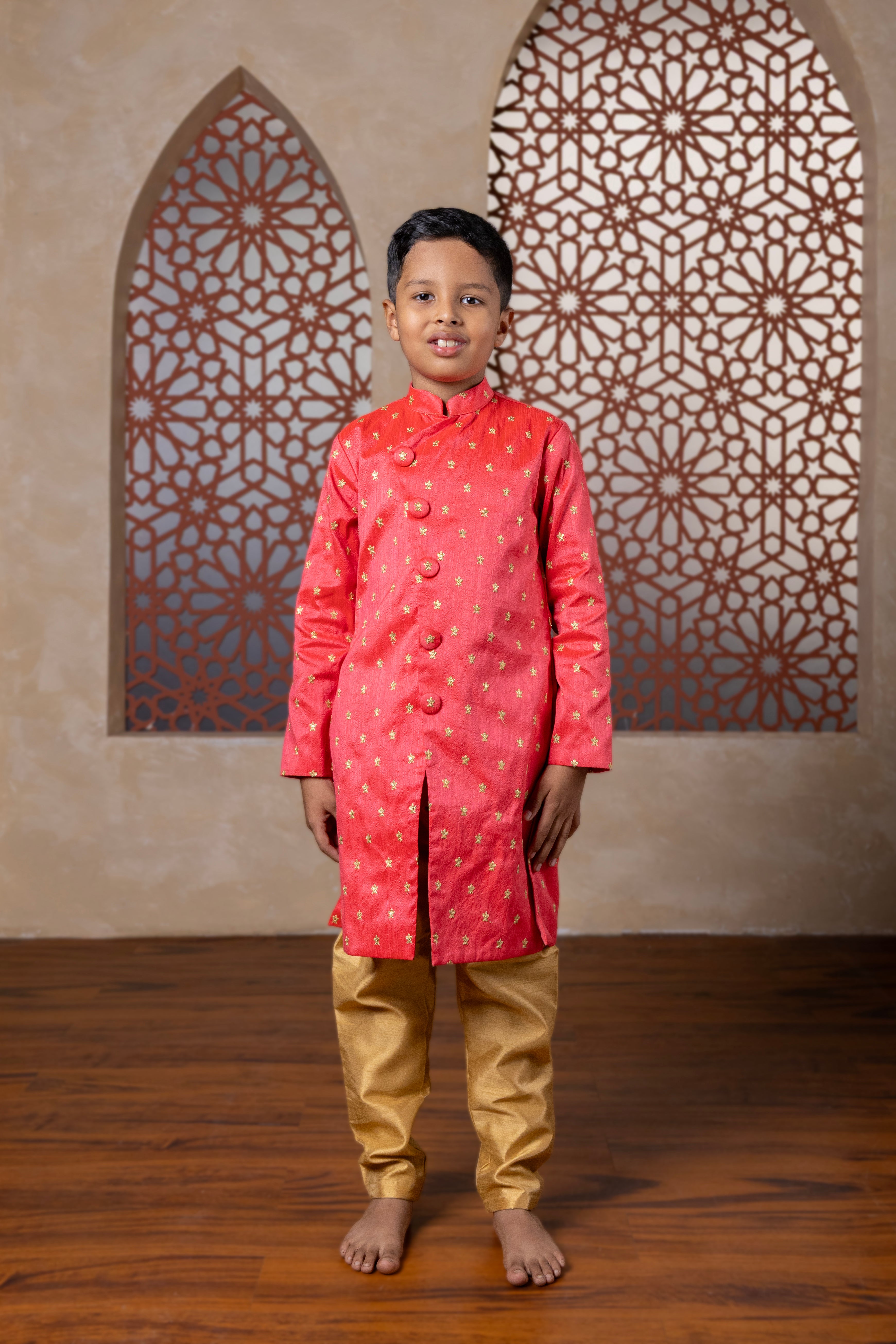 Coral raw silk with embroidered zari motifs sherwani with golden salwar for Batu