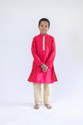 Tomato red raw silk stand collar kurta with sequined lace placket detailing with golden salwar for boys