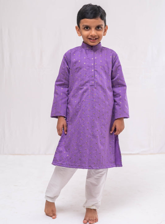 Lovendor pine silk with golden jari butta stand collar kurta with white cotton silk salwar set for Boys.Kurtas with collar or Angrakha pattern teamed with salwar are the best choice for any festive occasion for boys. They are Trendy, Easy to wear and comfortable to carry.