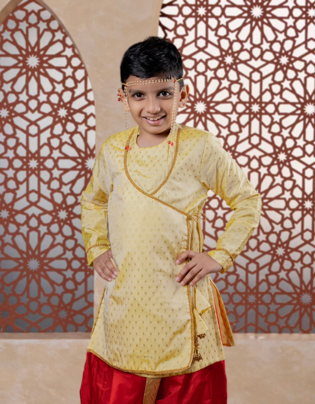 This cream-colored brocade silk kurta features a soft texture and an elegant angarakha design. The intricate neckline detailing combined with handcrafted latkans enhances its regal appeal, making it an ideal choice for a sophisticated, royal-inspired look.