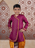 This wine-colored short kurta, crafted from cotton silk, features large jari butta designs and a front open style. Pearls-embellished lace accents delicately outline the curves and cuffs, making it a refined choice for Batu occasions.