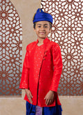 This Bright Red kurta features a half stand collar and is crafted from raw silk adorned with zari motifs. It showcases an elegant overlap pattern, perfect for Batu occasions.