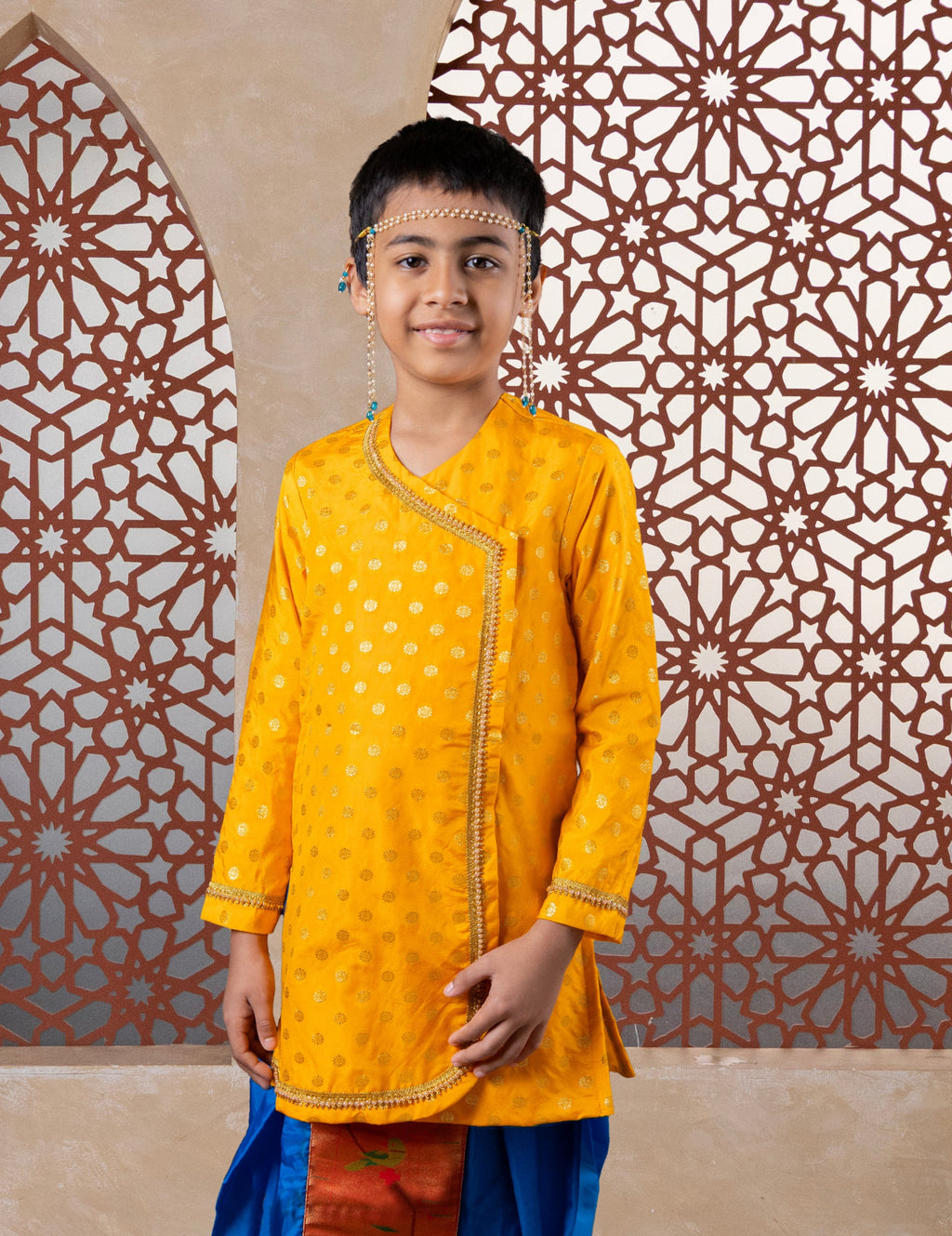 This yellow cotton silk short kurta features prominent jari butta detailing on the front and is adorned with pearl-embellished lace along the neckline and cuffs, enhancing its silhouette. The pre-stitched, ready-to-wear design pairs seamlessly with short kurtas, offering an elegant choice for traditional occasions including Matrubhojan, Muhurt, Munj, and Vratabandha ceremonies..