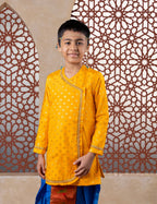 This yellow cotton silk short kurta features prominent jari butta detailing on the front and is adorned with pearl-embellished lace along the neckline and cuffs, enhancing its silhouette. The pre-stitched, ready-to-wear design pairs seamlessly with short kurtas, offering an elegant choice for traditional occasions including Matrubhojan, Muhurt, Munj, and Vratabandha ceremonies..