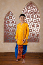 This yellow cotton silk short kurta features prominent jari butta detailing on the front and is adorned with pearl-embellished lace along the neckline and cuffs, enhancing its silhouette. The pre-stitched, ready-to-wear design pairs seamlessly with short kurtas, offering an elegant choice for traditional occasions including Matrubhojan, Muhurt, Munj, and Vratabandha ceremonies..
