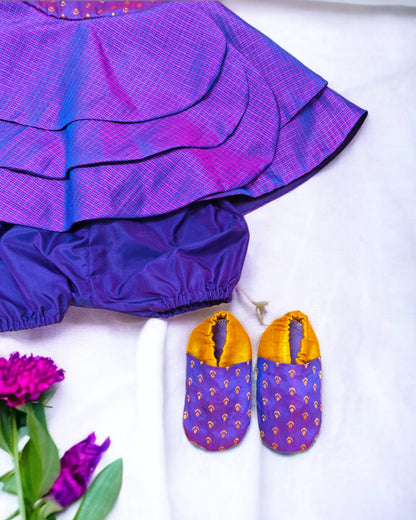 Purple front open layered dress with coordinated bloomer , headband and booties for a newborn baby girl.