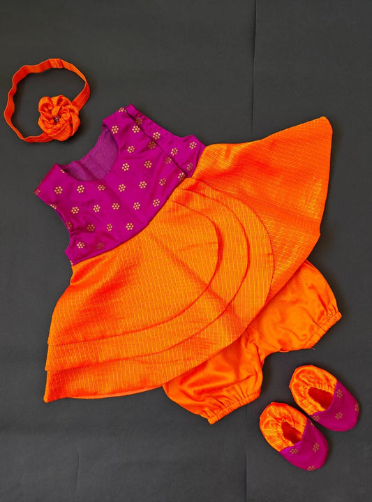 Purple soft brocade front open layered dress with coordinated bloomer,headband,booties for a newborn baby girl.It's the perfect outfit for your baby's naming ceremony,naamkaran or annaprashan ceremony.Traditional dress for Noolukettu Ceremony,Pachavi Puja,cradle ceremony,Rice Ceremony,Chatti Puja etc. Apt gifting idea