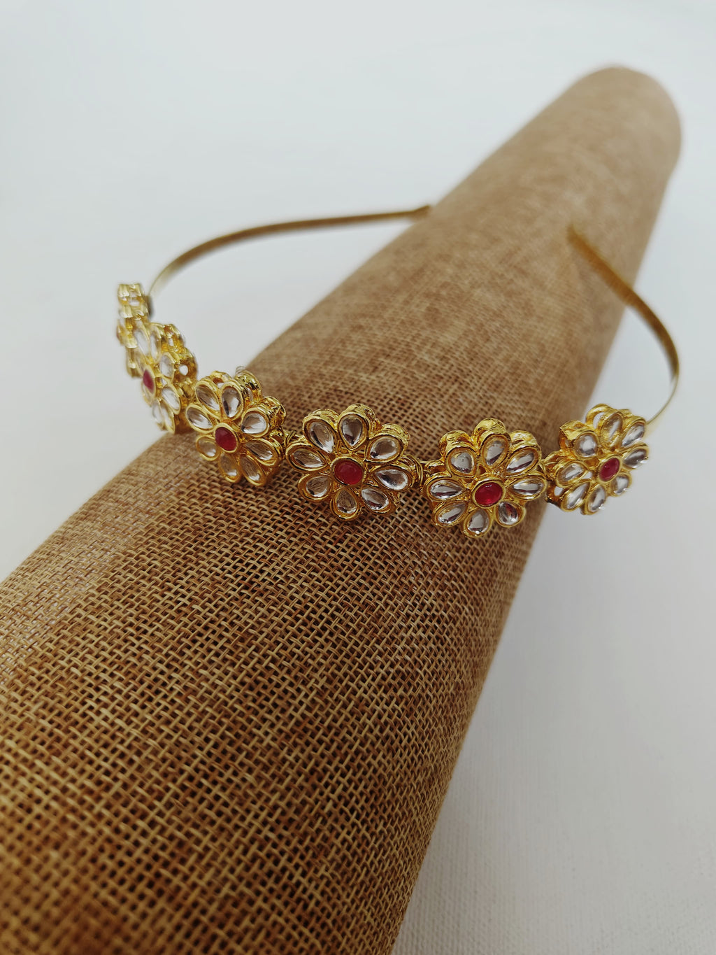 Kundan studded flower and leaves motifs mathapatti headband in golden metal for Girls.Adorn your princess with head to toe premium quality handcrafted accessories made from allergy free, best quality materials.