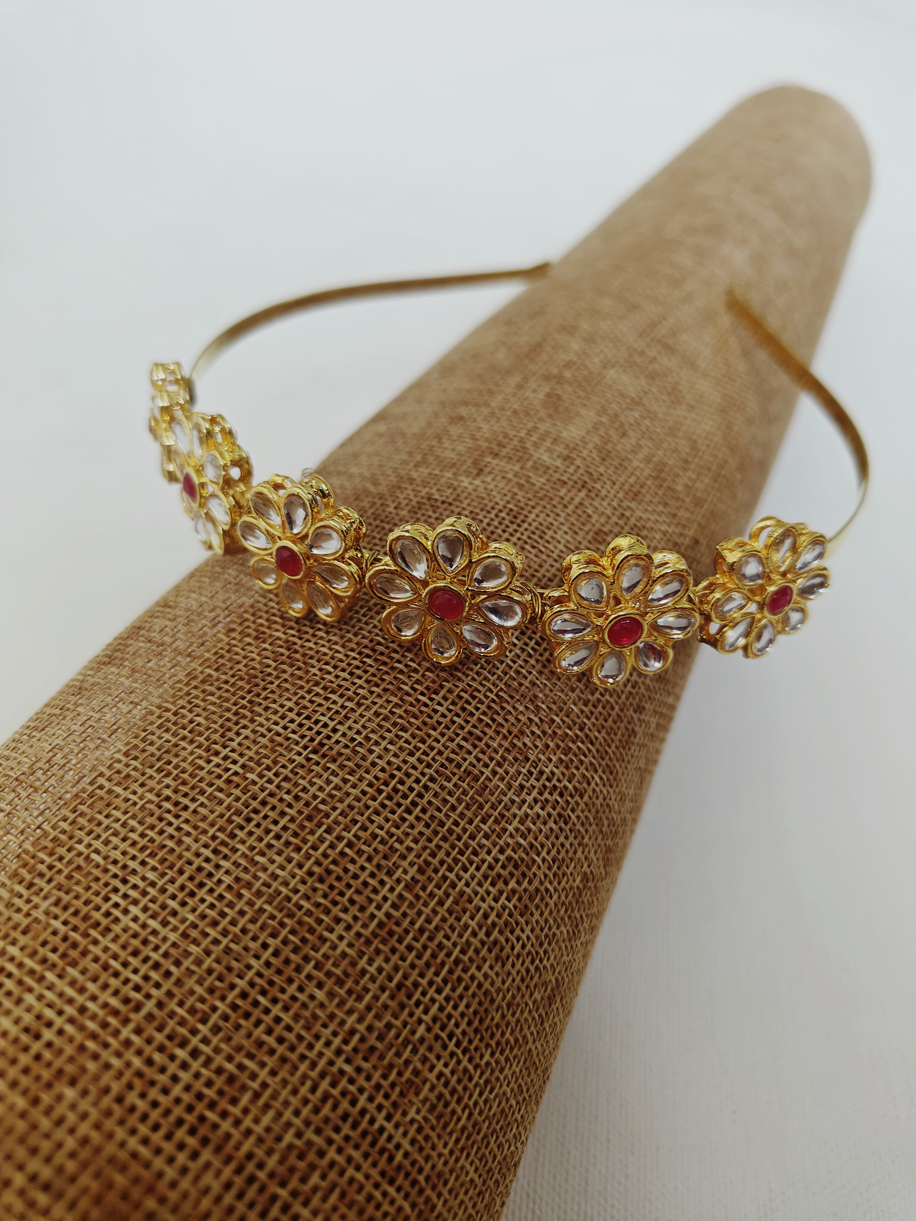 Kundan studded flower and leaves motifs mathapatti headband in golden metal for Girls.Adorn your princess with head to toe premium quality handcrafted accessories made from allergy free, best quality materials.