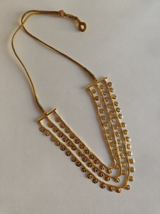 Three layered Lakshmi haar for girls.Effortlessly adjust the length of this three layered Lakshmi haar for girls with the convenient drawstring feature.