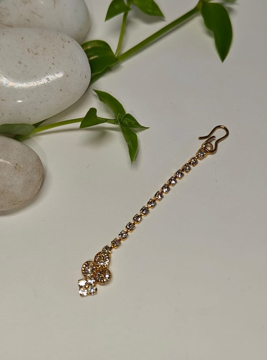 American Diamond Studded golden imitation Bud shaped metal Maang Tika for Girls.Adorn your princess with head to toe premium quality handcrafted accessories made from allergy free, best quality materials.
