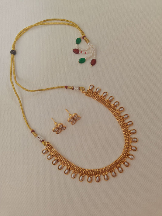 Pearls studded choker with matching earrings for Girls.This set includes a choker and matching earrings with studded pearls, perfect for girls. The drawstring allows for easy length adjustment.