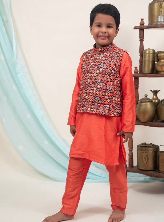 Orange cotton silk coordinated salwar kurta with digital printed  tussar silk jacket.Kurtas with collar or Angrakha pattern teamed with salwar are the best choice for any festive occasion for boys. They are Trendy, Easy to wear and comfortable to carry.