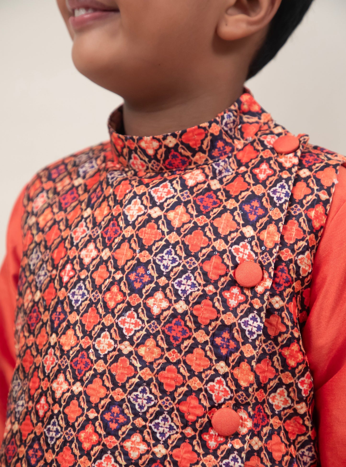 Orange cotton silk coordinated salwar kurta with digital printed  tussar silk jacket.Kurtas with collar or Angrakha pattern teamed with salwar are the best choice for any festive occasion for boys. They are Trendy, Easy to wear and comfortable to carry.