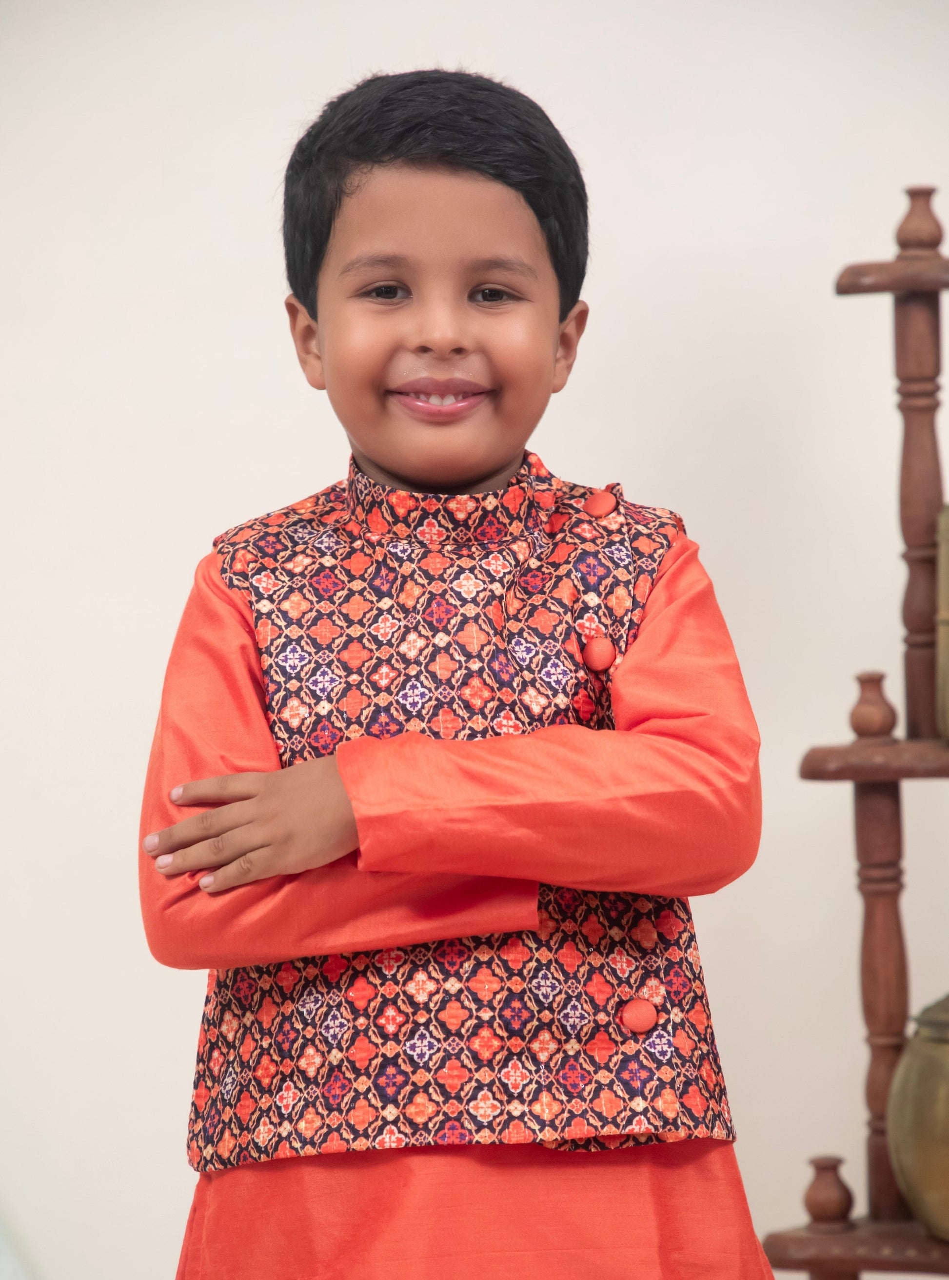 Orange cotton silk coordinated salwar kurta with digital printed  tussar silk jacket.Kurtas with collar or Angrakha pattern teamed with salwar are the best choice for any festive occasion for boys. They are Trendy, Easy to wear and comfortable to carry.