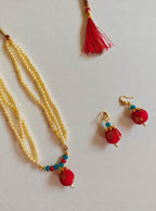 Red brocade fabric pendant and triple layered pearls necklace in combination with red and teal blue glass beads for Girls