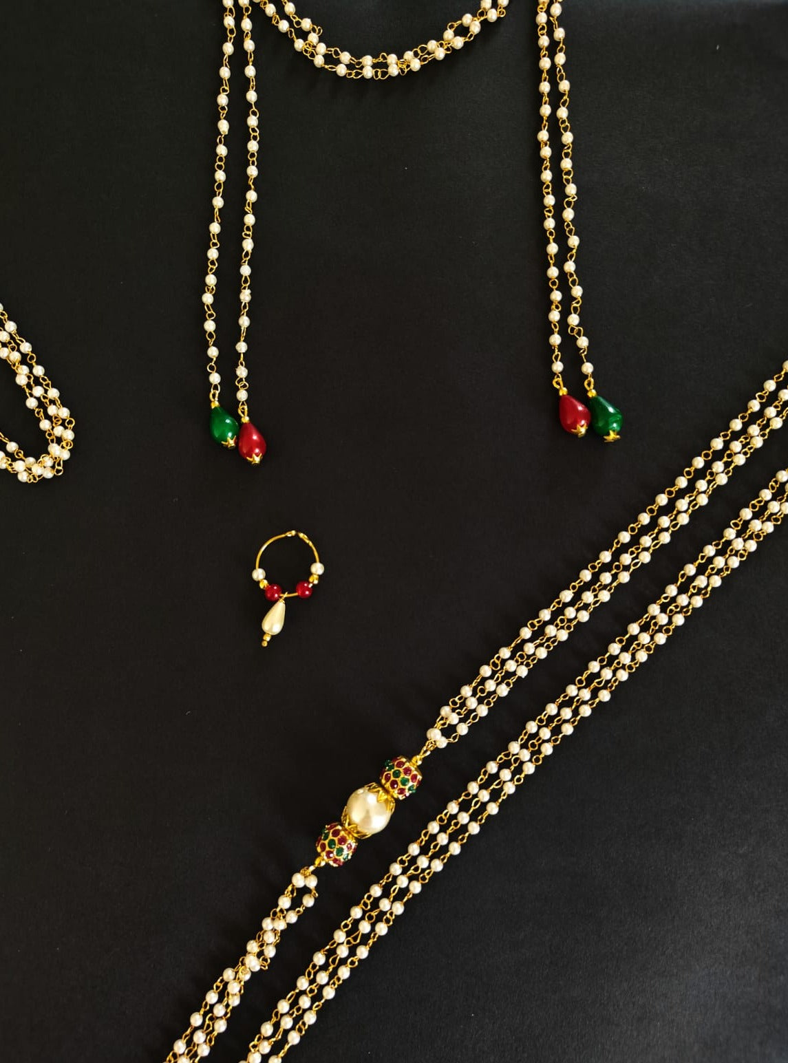 Vratabandha Pearls Accessories Combo with Red and Green colorful Findings for Batu includes Red Bhikbali, Red and Green Kanthi matching Mundavalya and Janav.Mundavalya,kanthi,bhikbali,topi,pagdi are boys accessories exclusively designed using Pearls,glass beads,jadau & gold plated findings for Batu,for Upanayan/Vratabandha/munj /thread ceremony.