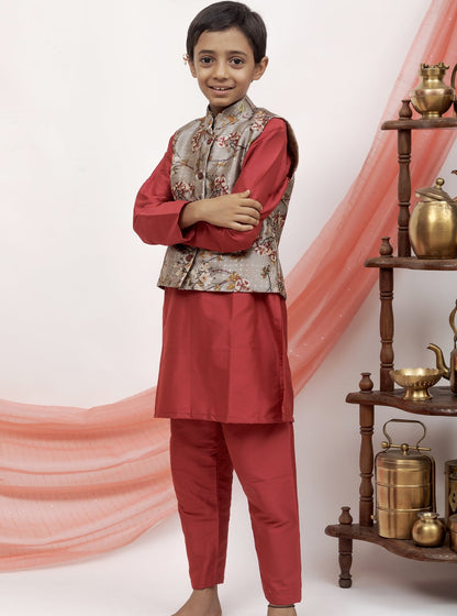 This maroon cotton silk salwar kurta set features a grey printed tussar silk jacket with statement buttons for a standout look.