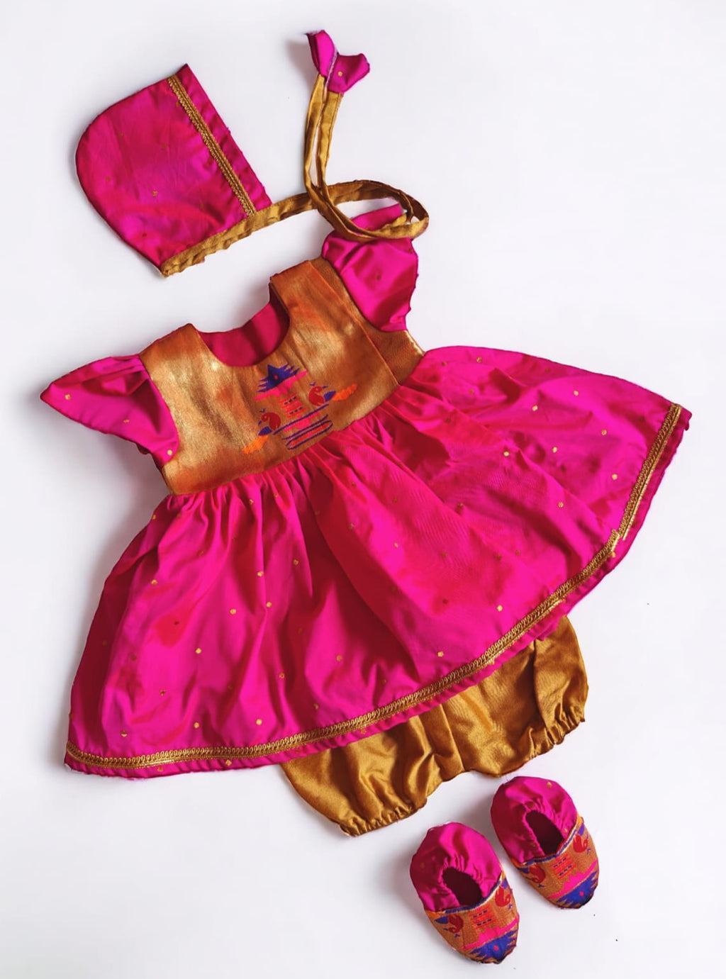 Rani Pink Paithani brocade silk,front open newborn dress for naming ceremony with bonnet, bloomer and booties.It's the perfect outfit for your baby's naming ceremony,naamkaran or annaprashan ceremony.Traditional dress for Noolukettu Ceremony,Pachavi Puja,cradle ceremony,Rice Ceremony,Chatti Puja etc. Apt gifting idea 