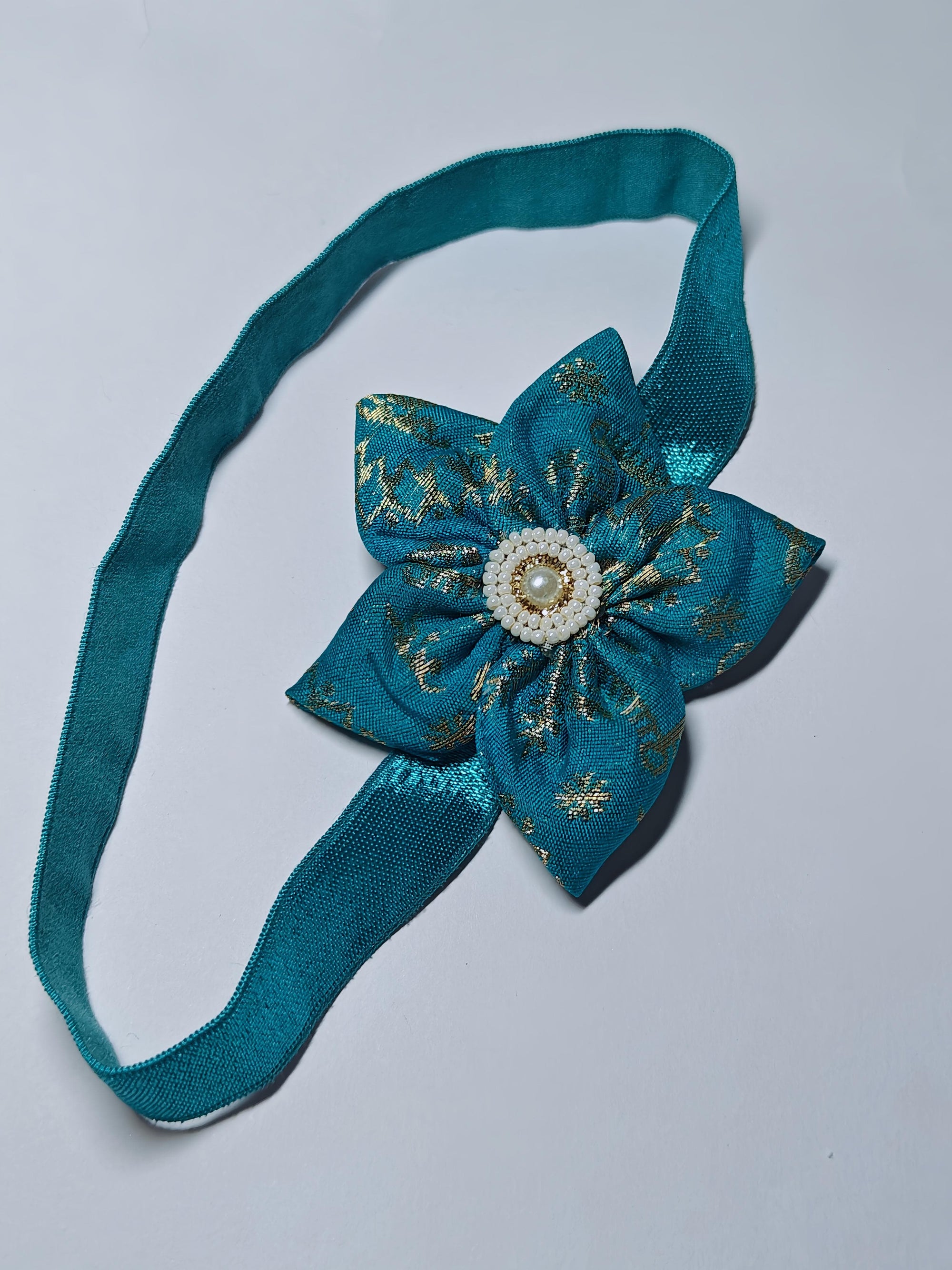 Cool Coloured Sadafuli Flower Stretchable headband for baby girl.Adorn your princess with head to toe premium quality handcrafted accessories made from allergy free, best quality materials.