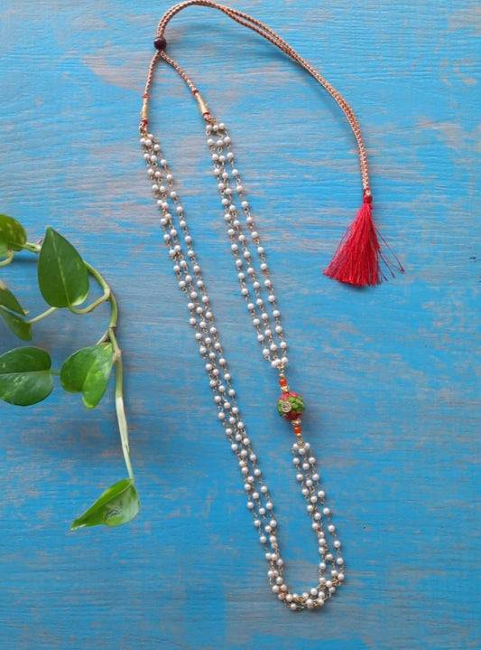 Orange Round Pachi bead with Pearl Triple Layer Kanthi for Batu. It is worn by Batu for Vratabandh/Munj/Upnayan/ Thread Ceremony.Mundavalya,kanthi,bhikbali,topi,pagdi are boys accessories exclusively designed using Pearls,glass beads,jadau & gold plated findings for Batu,for Upanayan/Vratabandha/munj /thread ceremony.