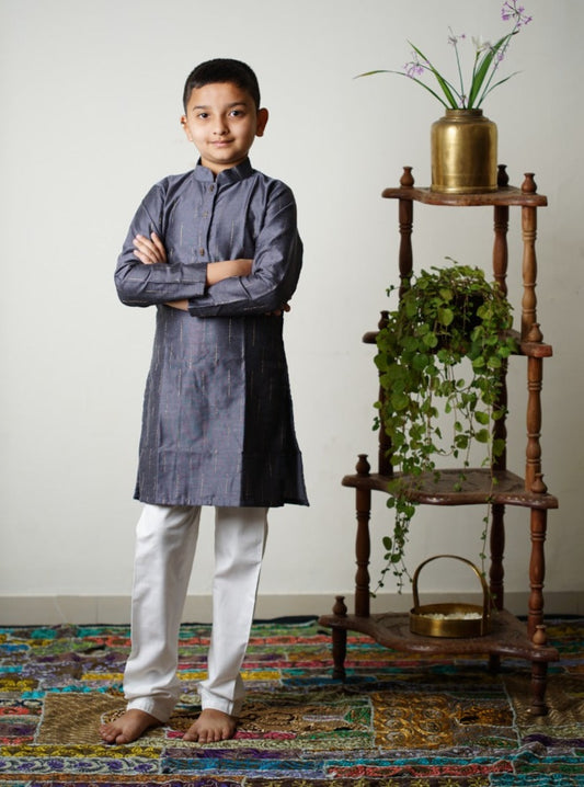 Slate grey pine silk Kurta with interesting jari stripes.Kurtas with collar or Angrakha pattern teamed with salwar are the best choice for any festive occasion for boys.They are Trendy, Easy to wear and comfortable to carry.
