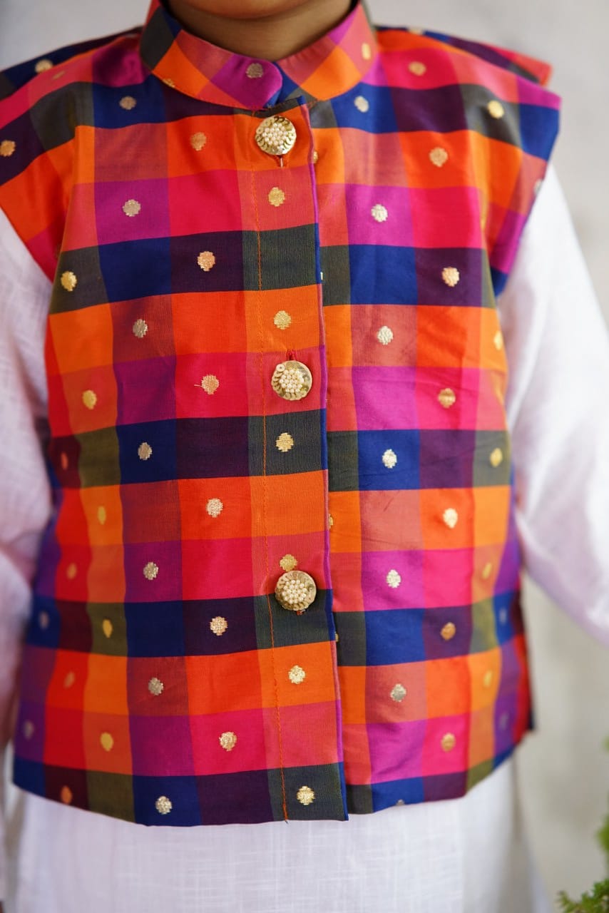Vibrant Multi coloured Stand Collar Taffeta Silk Jacket.Cotton lining from inside avoid sweating but give warmth.Statement embellished buttons add royal charm to these jackets. Team these with any plain colored kurta or satin shirt for best festive look! 