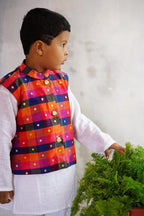 Vibrant Multi coloured Stand Collar Taffeta Silk Jacket.Cotton lining from inside avoid sweating but give warmth.Statement embellished buttons add royal charm to these jackets. Team these with any plain colored kurta or satin shirt for best festive look! 