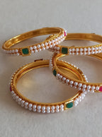 Two layered small pearls lines with square shaped red and green meena work Bangles Set of 4 for Girls.Adorn your princess with head to toe premium quality handcrafted accessories made from allergy free, best quality materials.