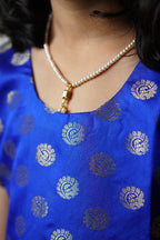 Royal blue banarasi brocade dress with woven jari borders for Girls.Let your princess be as comfortable as in her casuals with carefully designed & crafted Comfort Ethnic Wear by Soyara Ethnics.Keep her fashion quotient high with timeless patterns, vibrant combinations and royal textiles.