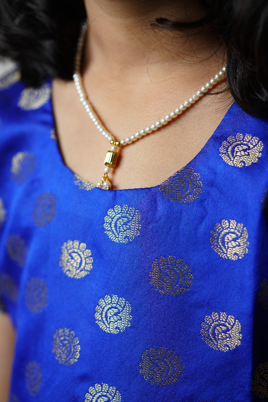 Royal blue banarasi brocade dress with woven jari borders for Girls.Let your princess be as comfortable as in her casuals with carefully designed & crafted Comfort Ethnic Wear by Soyara Ethnics.Keep her fashion quotient high with timeless patterns, vibrant combinations and royal textiles.