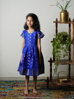 Royal blue banarasi brocade dress with woven jari borders for Girls.Let your princess be as comfortable as in her casuals with carefully designed & crafted Comfort Ethnic Wear by Soyara Ethnics.Keep her fashion quotient high with timeless patterns, vibrant combinations and royal textiles.