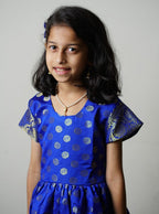Royal blue banarasi brocade dress with woven jari borders for Girls.Let your princess be as comfortable as in her casuals with carefully designed & crafted Comfort Ethnic Wear by Soyara Ethnics.Keep her fashion quotient high with timeless patterns, vibrant combinations and royal textiles.