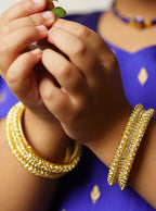 Three lined pearls and stones broad bangles Set of 2 for girls.Adorn your princess with head to toe premium quality handcrafted accessories made from allergy free, best quality materials.