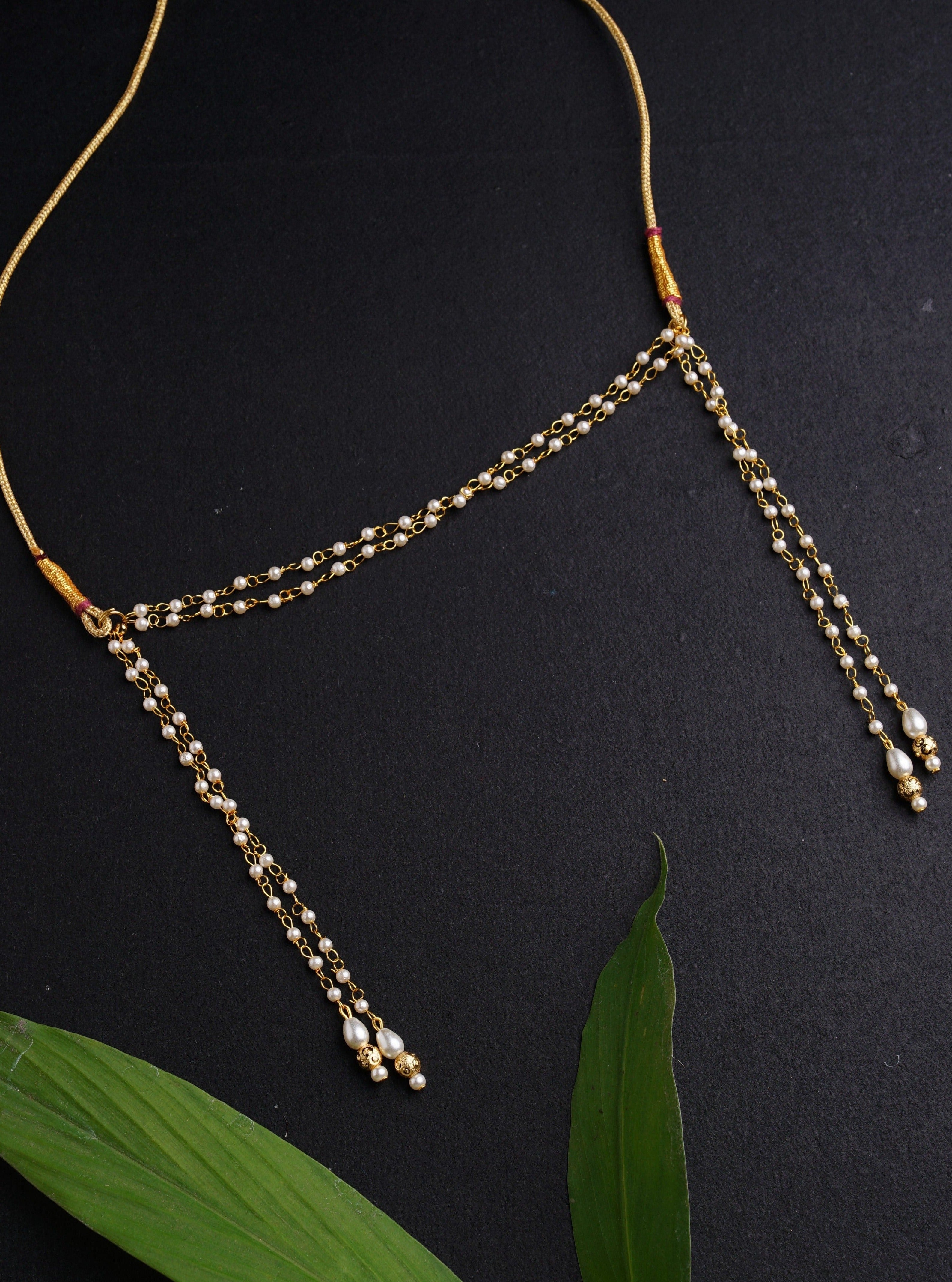 Mundavalya is a forehead ornament worn by Batu for Vratabandh/Munj/Upnayan/ Thread Ceremony.It is designed in pearls Golden Findings.Mundavalya,kanthi,bhikbali,topi,pagdi are boys accessories exclusively designed using Pearls,glass beads,jadau & gold plated findings for Batu,for Upanayan/Vratabandha/munj /thread ceremony.