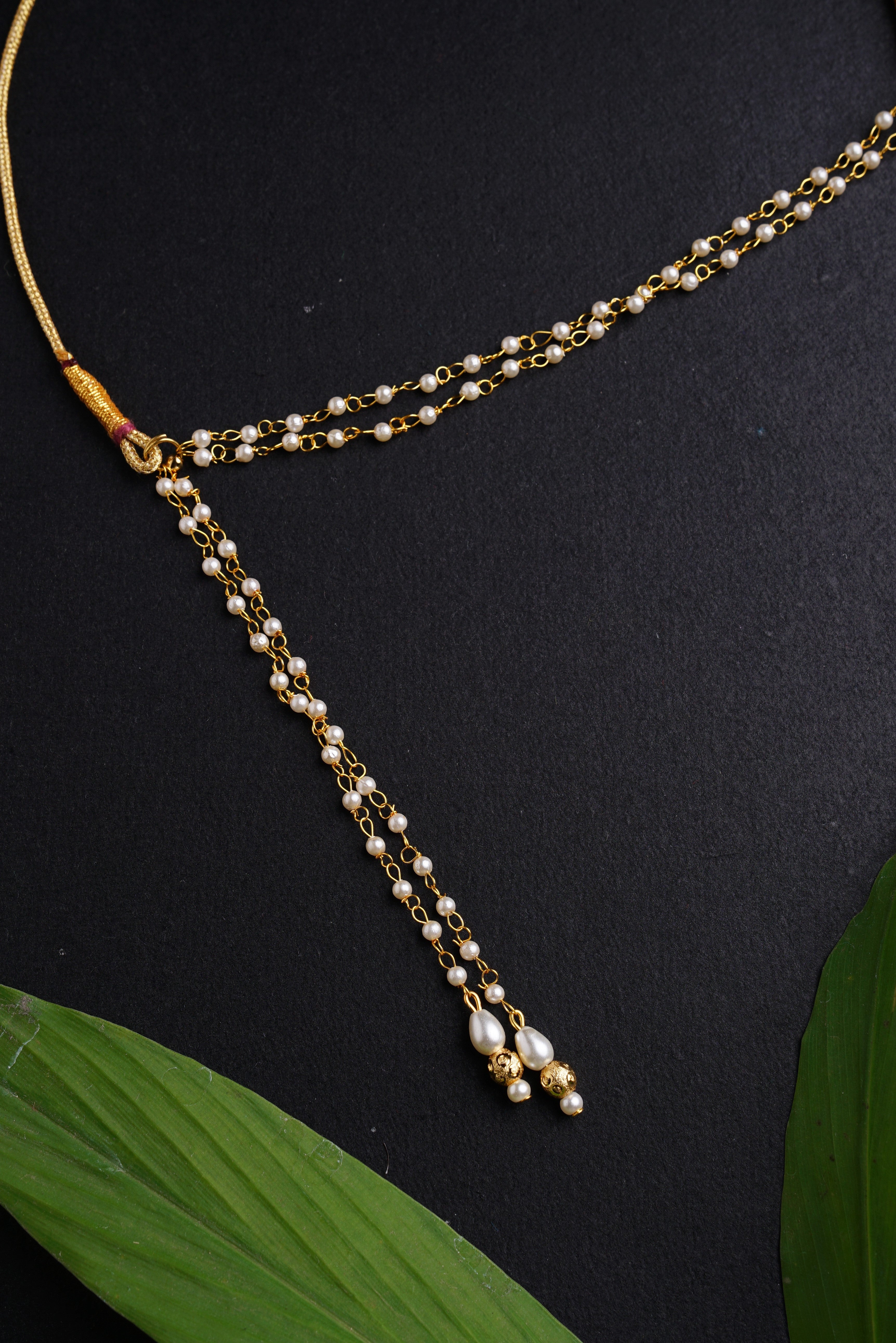 Mundavalya is a forehead ornament worn by Batu for Vratabandh/Munj/Upnayan/ Thread Ceremony.It is designed in pearls Golden Findings.Mundavalya,kanthi,bhikbali,topi,pagdi are boys accessories exclusively designed using Pearls,glass beads,jadau & gold plated findings for Batu,for Upanayan/Vratabandha/munj /thread ceremony.