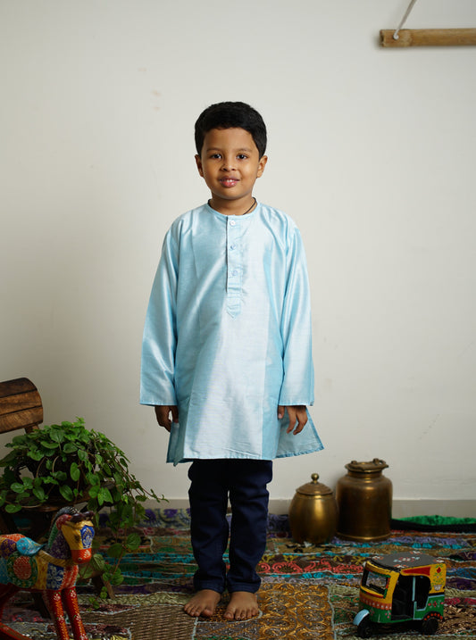 Light Sky Blue cotton silk Round neck long kurta with wooden buttons.Kurtas with collar or Angarakha pattern teamed with salwar are the best choice for any festive occasion for boys.They are Trendy, Easy to wear and comfortable to carry.